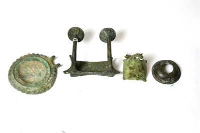 Lot 365 - A Roman bronze bracket with decorated handle like supports, circa 1st-2nd century AD, the...