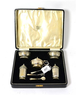 Lot 407 - A cased silver cruet comprising of two salts and a mustard (all with blue glass liners) two...