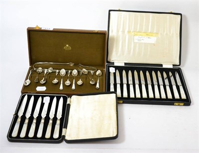 Lot 414 - A set of twelve Swedish white metal coffee spoons, a pair of Hester Bateman sugar tongs, cased cake