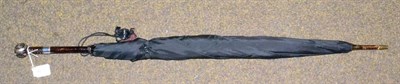 Lot 425 - A black silk umbrella with silver pique decorated handle