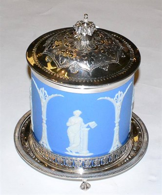 Lot 451 - A Wedgwood blue jasper ware biscuit barrel, with silver plated hinged cover and stand