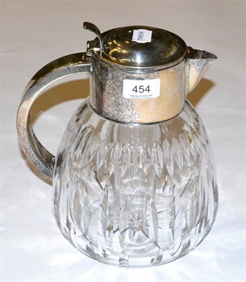 Lot 454 - A cut glass lemonade jug with silver plated mounts