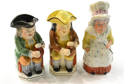 Lot 461 - Three toby jugs, two modeled as gentlemen, the other as a woman