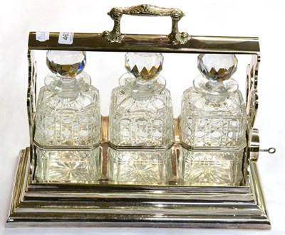 Lot 463 - A Walker & Hall silver plated tantalus, with three cut glass decanters and stoppers