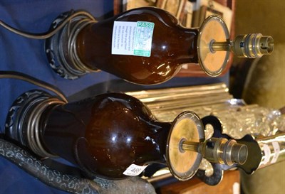 Lot 469 - A pair of brown glazed table lamps on hardwood stands, 30cm high