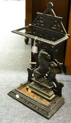 Lot 1008 - Cast iron stick stand and a cast iron door stop modelled as a standing lion