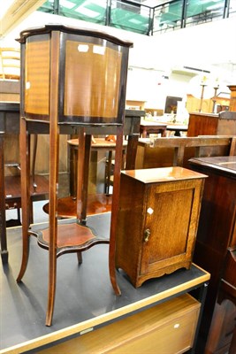 Lot 1031 - An Edwardian mahogany two tier plant stand and a small early 20th century oak cupboard