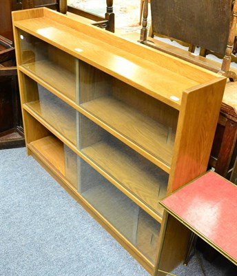 Lot 1033 - A 20th century glazed oak low bookcase