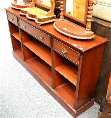 Lot 1035 - A modern low bookcase fitted with three frieze drawers