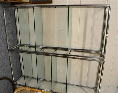 Lot 1039 - Pair of modern chrome and glass open shelves