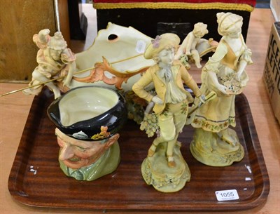 Lot 1055 - Three Austrian ceramic pieces, a pair of figures, a figural centrepiece with fisher women and...