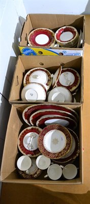 Lot 1065 - A quantity of red and gilt highlighted dinnerwares by Meakin and Crown Staffordshire (in three...