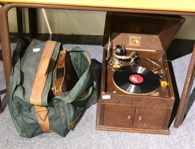 Lot 1068 - HMV oak cased table top gramophone with records