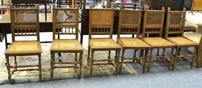 Lot 1119 - A set of six oak chairs with bergere seat and backs