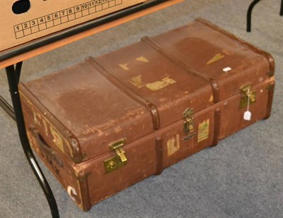 Lot 1151 - A brown canvas mounted trunk including linen sheets, textiles, cotton night dress etc