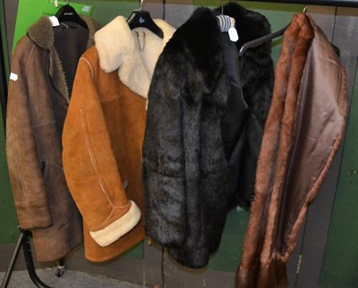 Lot 1155 - A black pony fur jacket, a fur stole and two sheepskin jackets