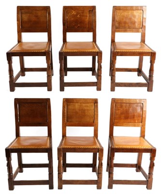 Lot 537 - Mouseman: A Set of Six Robert Thompson English Oak Panel Back Dining Chairs, with cow hide...