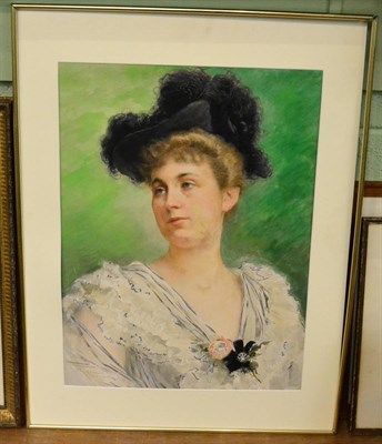 Lot 1189 - Fernand Toussaint (1873-1956) Portrait of an elegant lady, head and shoulders wearing a black...