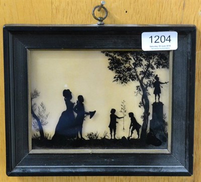 Lot 1204 - A group silhouette in ebonised frame