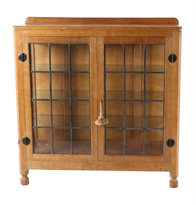 Lot 542 - Mouseman: A Robert Thompson English Oak Display Cupboard, with raised upstand above leaded...