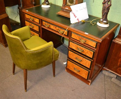 Lot 1250 - A late Victorian walnut twin-pedestal desk and a green upholstered tub chair