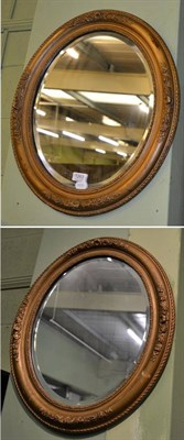 Lot 1263 - Two oval gilt framed mirrors