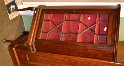 Lot 1266 - An Edwardian mahogany glazed corner cabinet on later stand