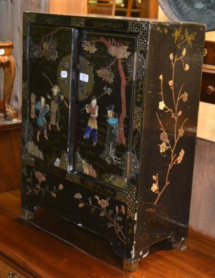 Lot 1271 - A small Chinese inlaid black lacquer cabinet, with glass protector