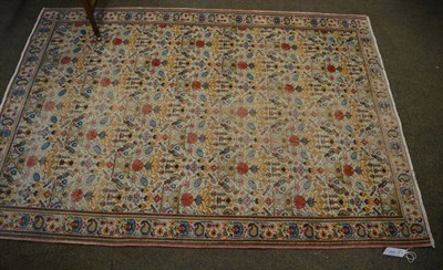 Lot 1281 - A Ghom rug, Central Iran, the ivory field with a one way design of urns issuing flowers enclosed by