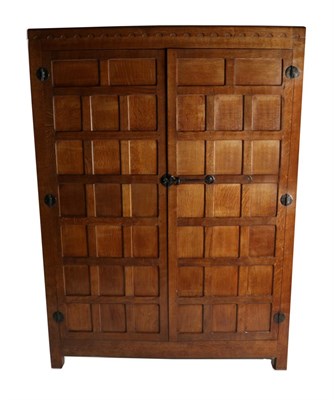 Lot 549 - Mouseman: A Robert Thompson Panelled English Oak Wardrobe, with half penny moulding above two...