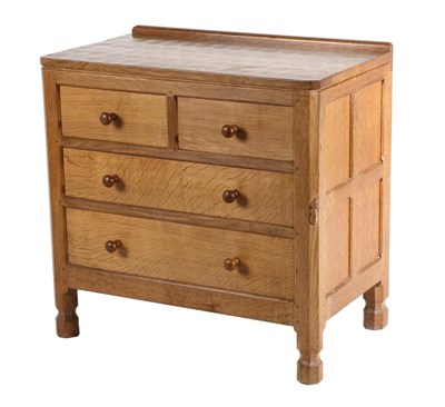 Lot 550 - Mouseman: A Robert Thompson English Oak Chest of Drawers, with raised upstand above two short...