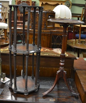 Lot 1302 - An early 19th century mahogany octagonal two tier stand with fluted column supports, together...