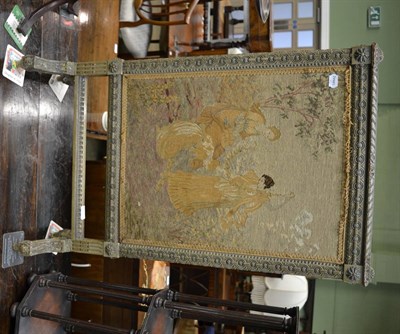 Lot 1303 - A carved and painted fire screen in Louis XVI style, with needlework panel