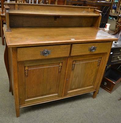 Lot 1306 - Arts & Crafts style oak sideboard with hammered pewter handles