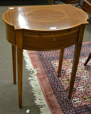 Lot 1308 - A mahogany reproduction occasional table with shaped top, a slide over a drawer, with key