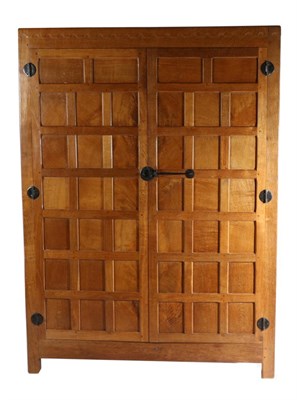 Lot 551 - Mouseman: A Robert Thompson Panelled English Oak Wardrobe, with half penny moulding above two...