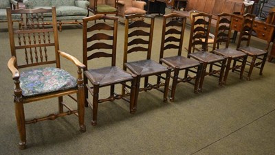 Lot 1327 - Composite set of six 19th century ladder back chairs and a carver chair with rush seat