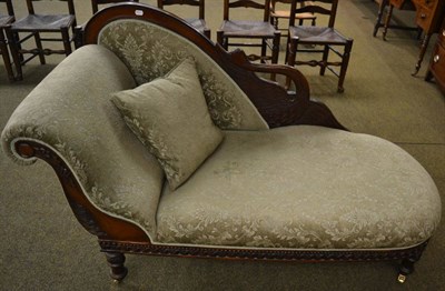 Lot 1328 - Reproduction day bed carved with a swan, upholstered in pale green cut velvet