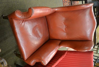 Lot 1339 - A red leather wing armchair