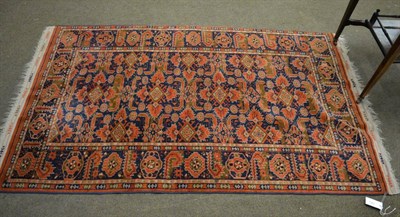 Lot 1343 - An Afghan Beshir rug, the indigo field of serrated leaves centred by a column of diamond medallions