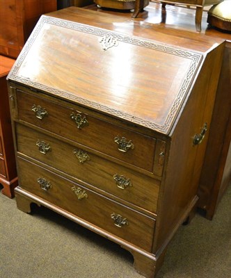 Lot 1357 - A late George III carved mahogany bureau, 83cm wide