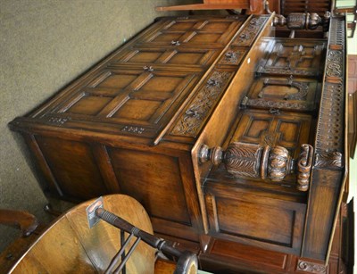 Lot 1362 - Reproduction carved and panelled oak buffet