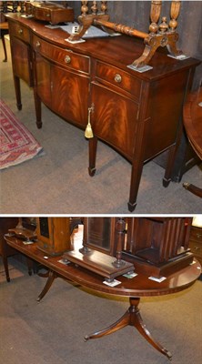 Lot 1365 - A reproduction dining table with matching bow fronted sideboard