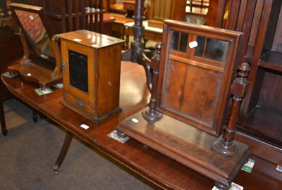 Lot 1366 - Two 19th century mahogany toilet mirrors and a small oak smoker's cabinet with embossed panel