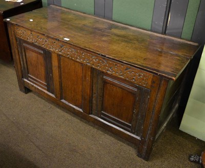 Lot 1383 - An 18th century carved oak blanket chest