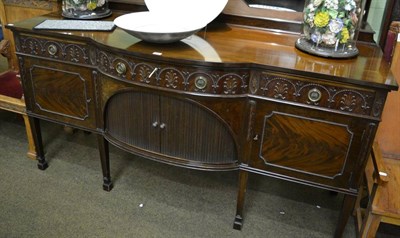 Lot 1386 - A large mahogany sideboard with tambour front