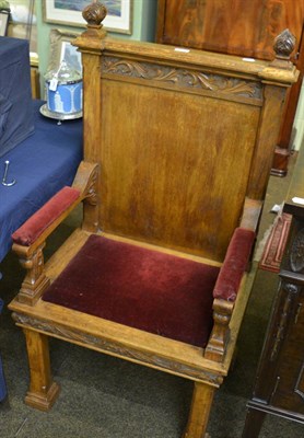 Lot 1387 - A Gothic carved oak chair