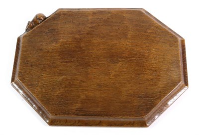 Lot 562 - Mouseman: A Robert Thompson English Oak Bread Board, with carved mouse signature, 31.5cm See...