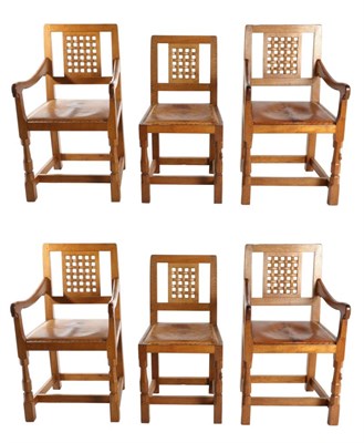 Lot 565 - Mouseman: A Set of Six (2+4) Robert Thompson English Oak Dining Chairs, nailed tan hide seats,...