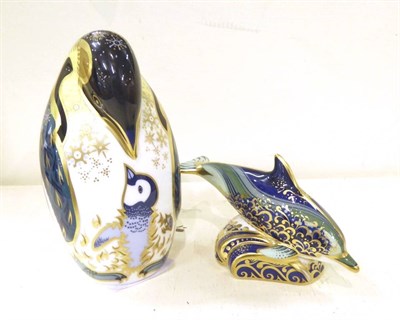 Lot 63 - Royal Crown Derby paperweights baby bottle nose dolphin and penguin and chick (2)